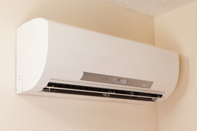 If you want a versatile HVAC system you can customize from room to room in your St. John, home, look no further than a ductless mini split. A wall-mount mini-split heating and air conditioning unit installed in a new house. A modern heat pump, this unit heats a house in winter and cools in the summer. This type of system eliminates ductwork which is a primary source of inefficiency in a conventional system making this about 30% more efficient. This particular unit has an eye sensor which pans the room looking for hot or cold spots and directs the airflow accordingly.